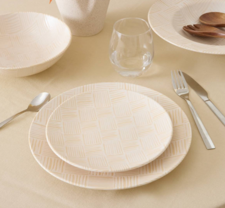 small and large white textured plate set